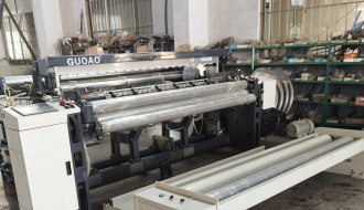 New type GA910 air jet loom with outside batching system